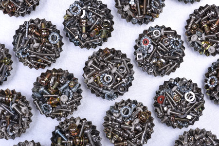 Bolts screws and nuts in containers top view concept Industry