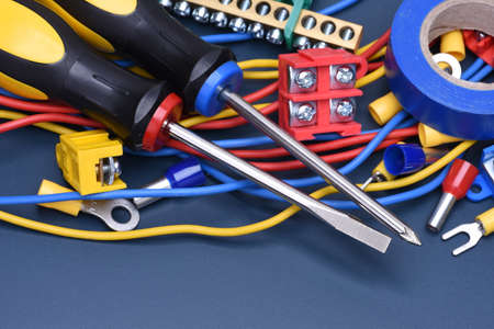 Electrical component kit to use in electrical installations on blue metal backgroundの写真素材