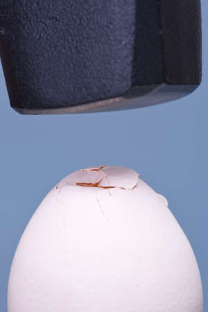 Heavy hammer and broken eggの写真素材