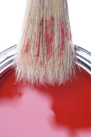 Top view of red paint can with brush isolated on white backgroundの写真素材