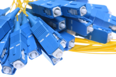 Fiber cables SC connectors closeup isolated on white background