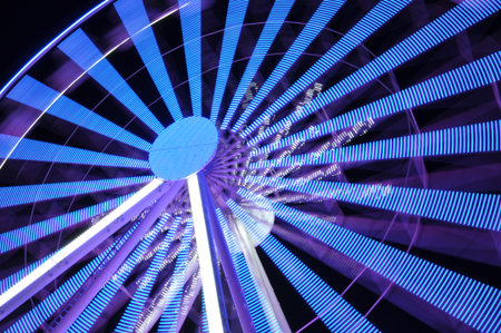 Spinning ferris wheel at night lightの写真素材
