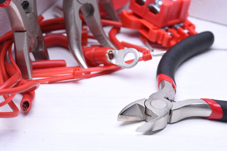 Group of electrical tools and cable on wooden boardの写真素材