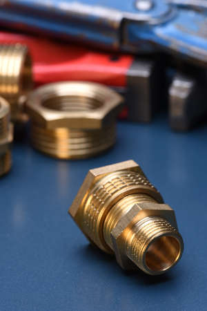 Brass fittings and wrench closeupの写真素材