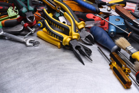 Set of tools on gray metal background, copy spaceの写真素材