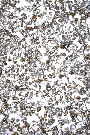 Nuts and bolts on gray metal background