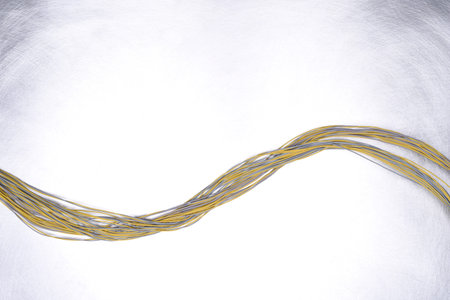 Electrical cable on gray metal background, copy space