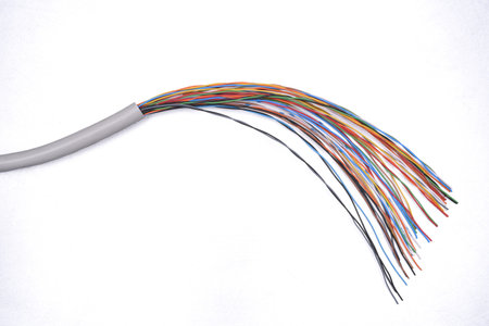 Electrical cable on gray metal background, copy space