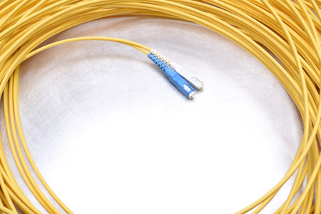 Optical patch cord single mode SC on metal backgroundの写真素材