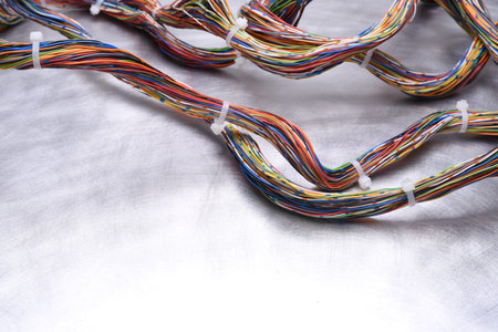 Colorful swirl of Electrical Cables on Metal background with Copy Space