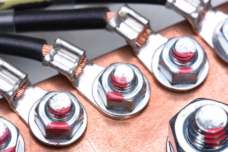 Screw and nut connection of copper elements close up, energy industryの写真素材