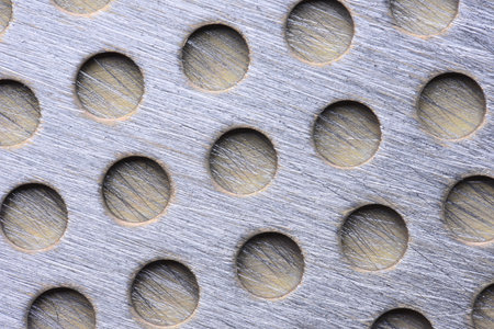 Industrial background metal sheet with holes