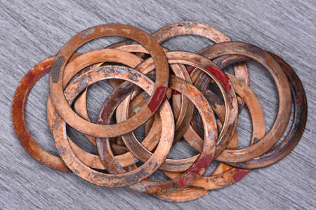 Old Copper Washers on Metal Background, Top Viewの写真素材
