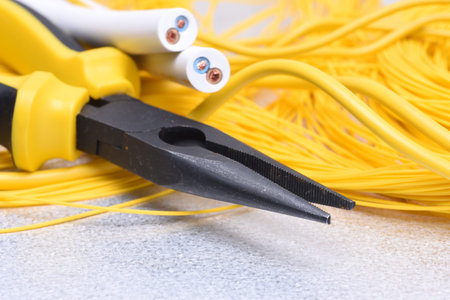 Electrical tools and cables on metal surface