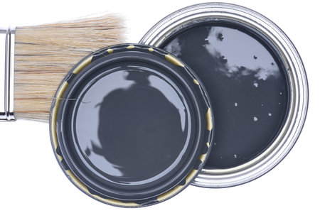 Paintbrush and can with steel paint isolated on white