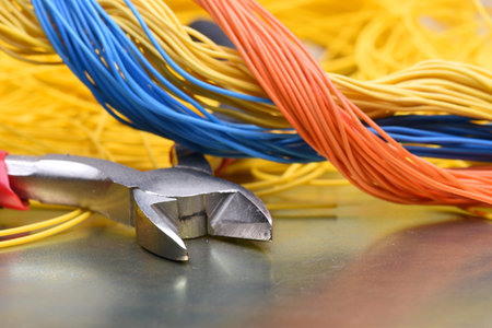 Tools for electrician and cables closeup