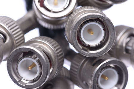 Close up of bunch of bnc connectors isolated on white backgroundの写真素材