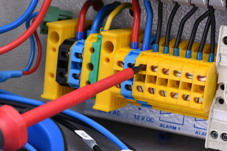 Electrical panel and tool in switchgear cabinet close-up