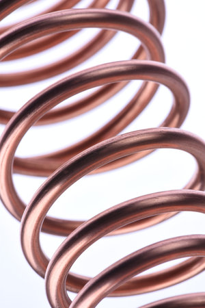 Copper wire close-up isolated on white backgroundの写真素材