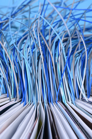 Opened book with computer network cables, download and upload information concept
