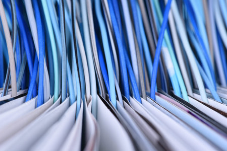 Opened book with computer network cables. Close-up, transfer and informationの写真素材