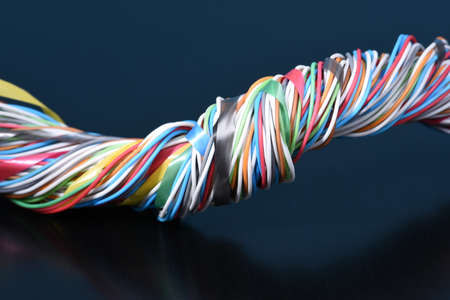 Multicolored electrical cable on dark backgroundの写真素材