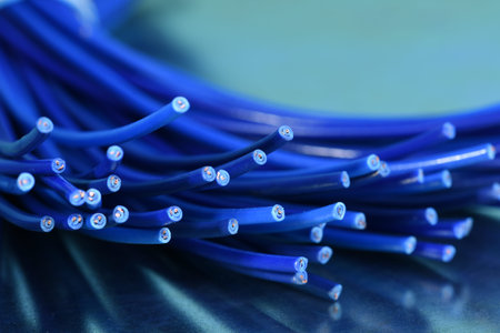 Electrical cables on metal board with reflection closeup