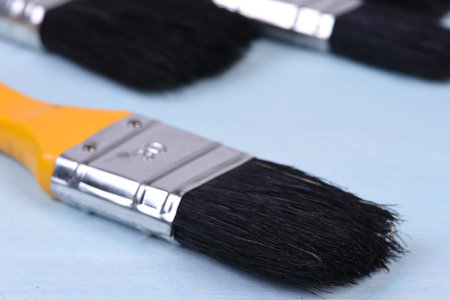 Paintbrush on wooden table closeupの写真素材