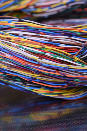 Surface with reflection of colorful electrical wires