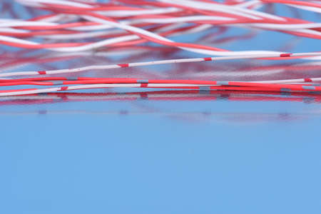 Colorful telecommunication cables on metallic surface with reflectionの写真素材