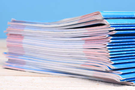 Stack of magazines on blurred backgroundの写真素材