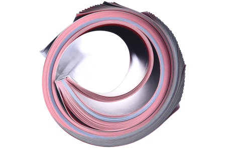 Rolled magazine isolated on white background