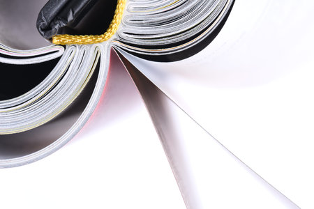Macro view of book pages isolated on white background
