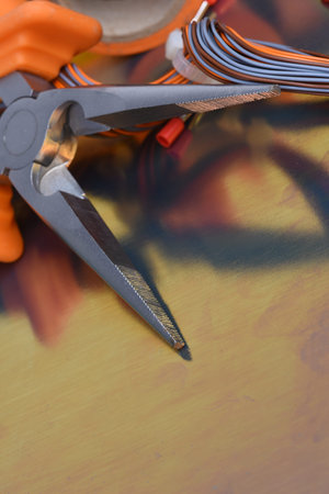 Electrical tool and components on metallic background