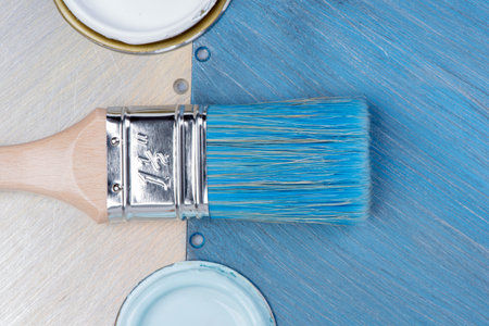 Paintbrush and Can Lid with Paint on Metal Table, Top View