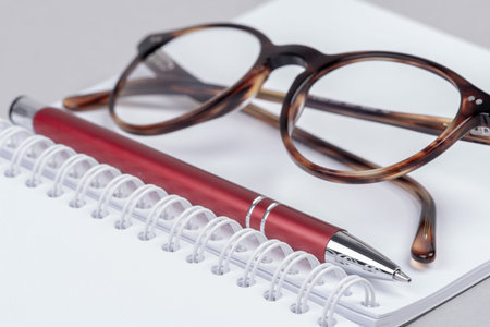 Personal accessories for work in office, notebook, pen and glasses