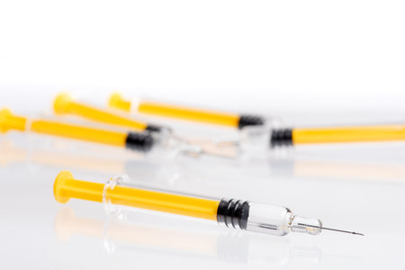 Medical syringe on table in hospital laboratory