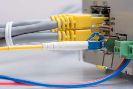Fiber optic cable and network  patch cord connect to the switch, data center conceptの写真素材