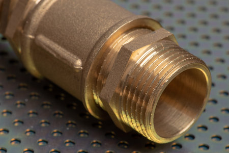 Brass fittings close-up on metallic surface