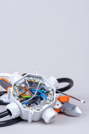 Components for use in electrical installations, junction box, cables and tools