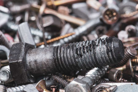 Close-up of used steel bolt workshop backgroundの写真素材