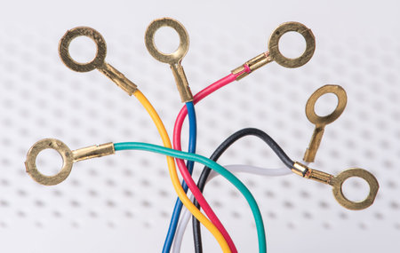 Telecommunication cables terminated with ring lug connectors