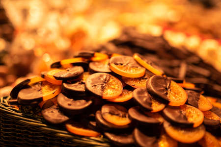 Candied Oranges Dipped in Chocolate on Market Food Stallの写真素材