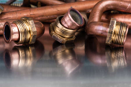 Plumbing and heating fittings installation and service, items after repair on metal surface of workshopの写真素材