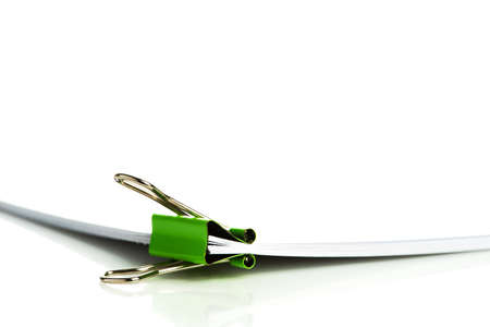 Office document with binder clip on white backgroundの写真素材