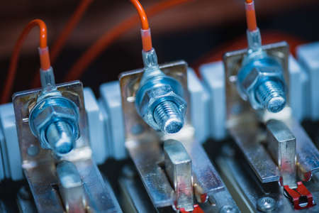 Joint with bolts and nuts in electrical switchboard close-upの写真素材
