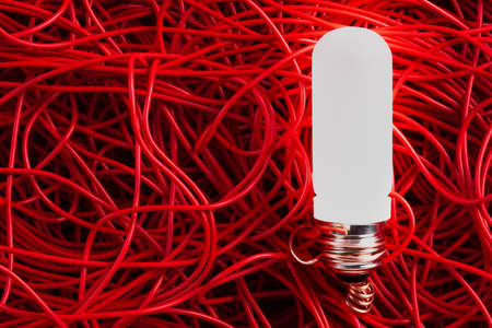 Light bulb and red electrical cable wireの写真素材