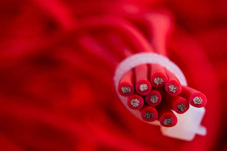 Close-up bundle of red electrical cables electrical installation componentの写真素材