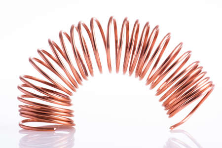 Spiral copper wire on white backgroundの写真素材