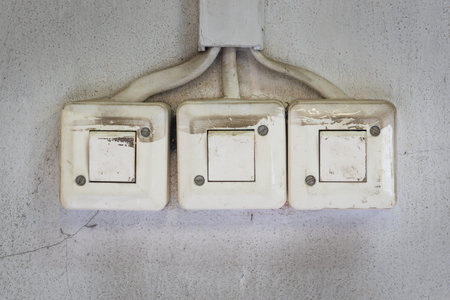 Close-up of old electrical wall switches